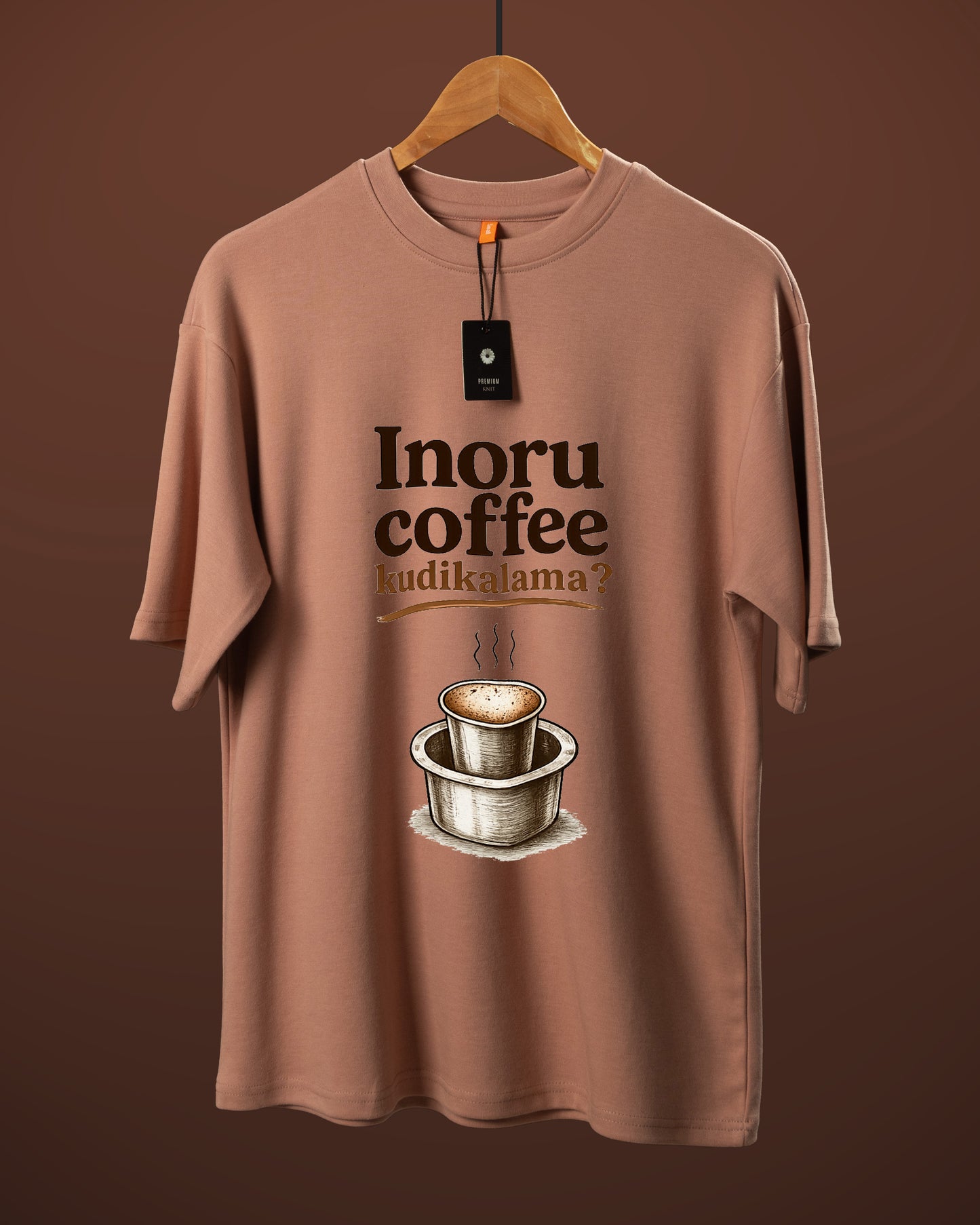 DUMM Inoru Coffee Kudikalama oversized t-shirt in dusty rose on wooden hanger