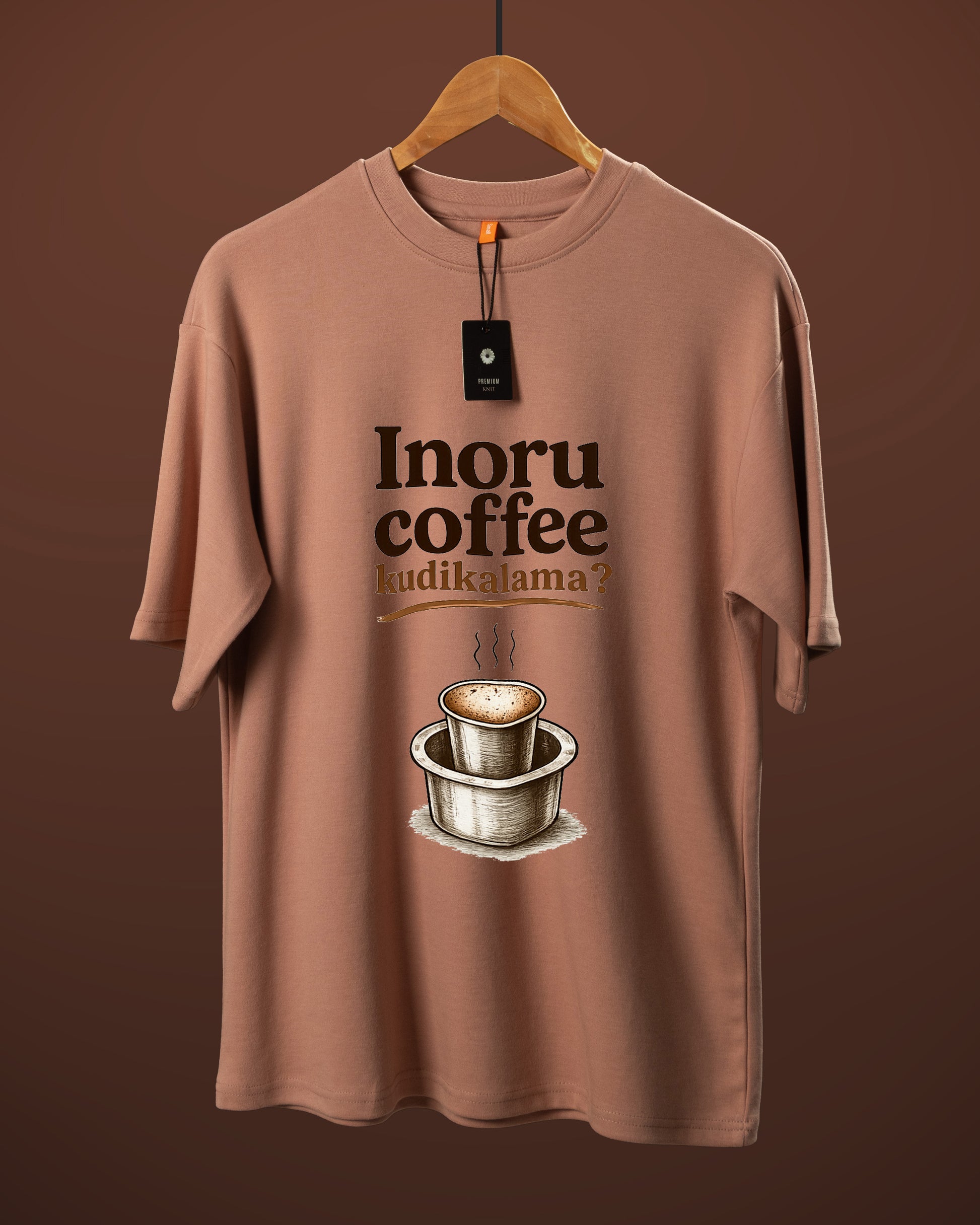 DUMM Inoru Coffee Kudikalama oversized t-shirt in dusty rose on wooden hanger